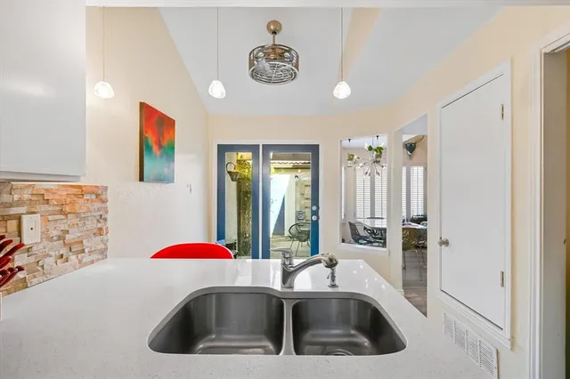 a bathroom with a sink and a shower