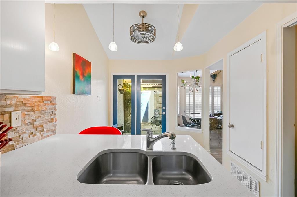 18040 Midway Road, Unit 225 Dallas, TX 75287 - Photo 14 of 24 a bathroom with a sink and a shower