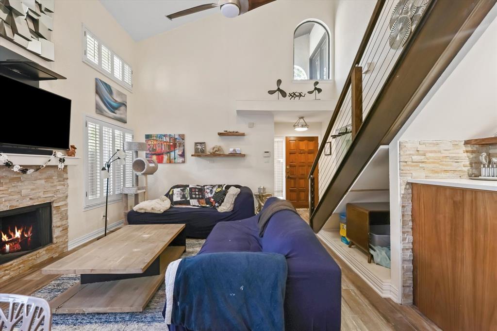 18040 Midway Road, Unit 225 Dallas, TX 75287 - Photo 23 of 24 a living room with furniture fireplace and flat screen tv