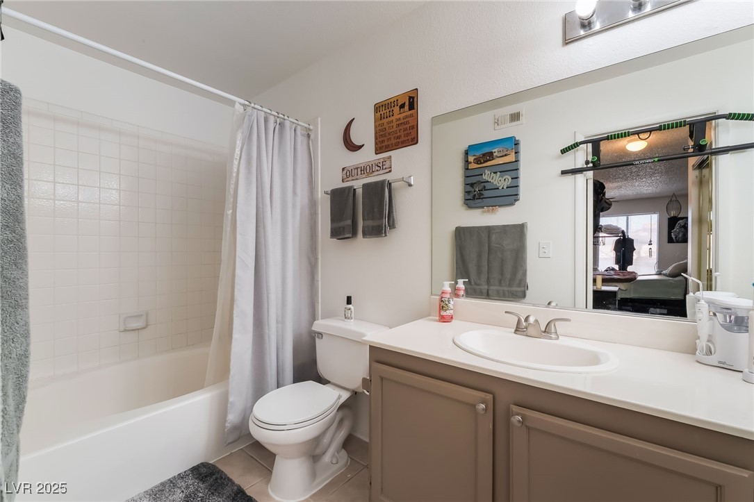 1575 West Warm Springs Road, Unit 2822 Henderson, NV 89014 - Photo 26 of 37 Full bath with toilet, shower / tub combo, vanity, and tile patterned floors