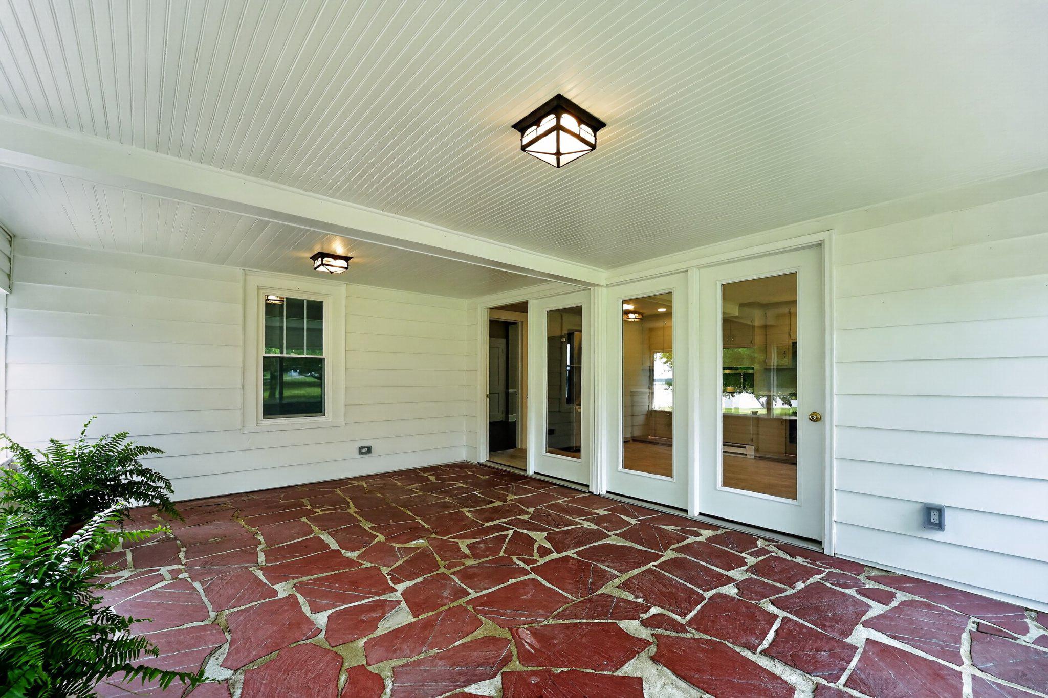 300 Woods Point Road Chester, MD 21619 - Photo 51 of 78 Spacious screened porch with stone flooring.
