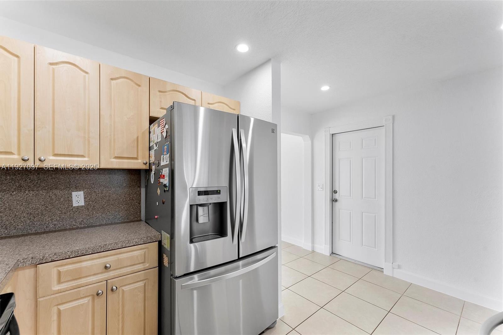 5511 Southwest 36th Court Davie, FL 33314 - Photo 11 of 23 a kitchen with stainless steel appliances a refrigerator and cabinets