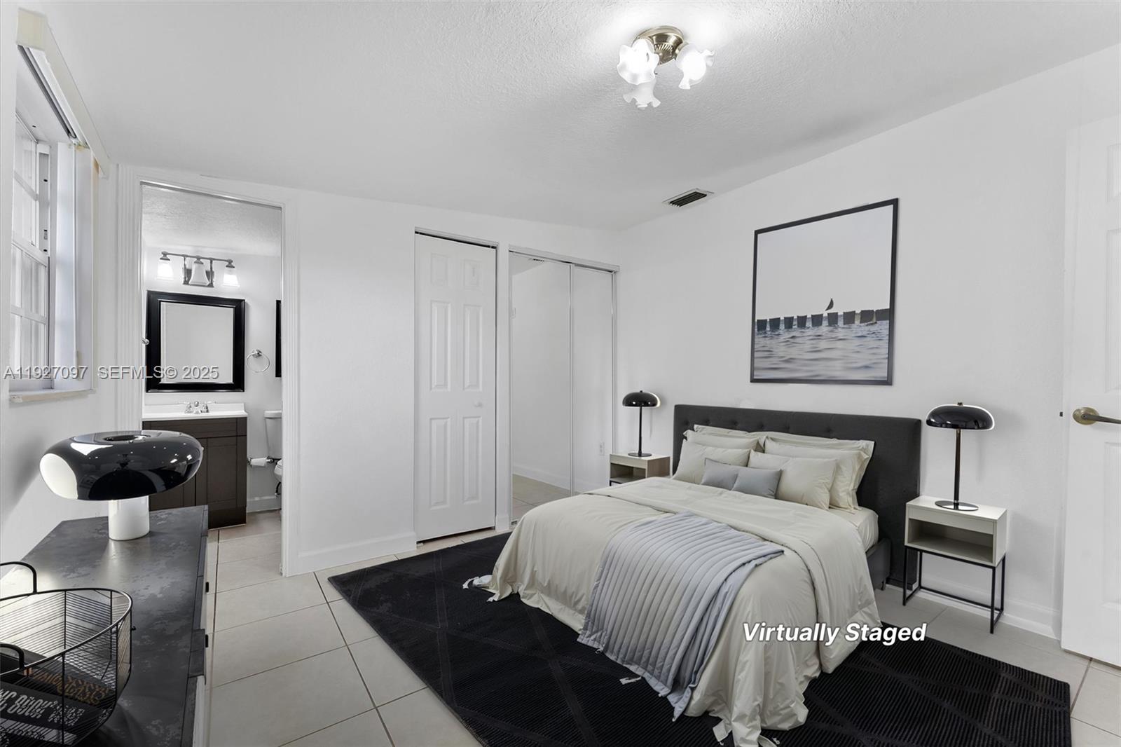 5511 Southwest 36th Court Davie, FL 33314 - Photo 12 of 23 a bedroom with a bed and a chandelier
