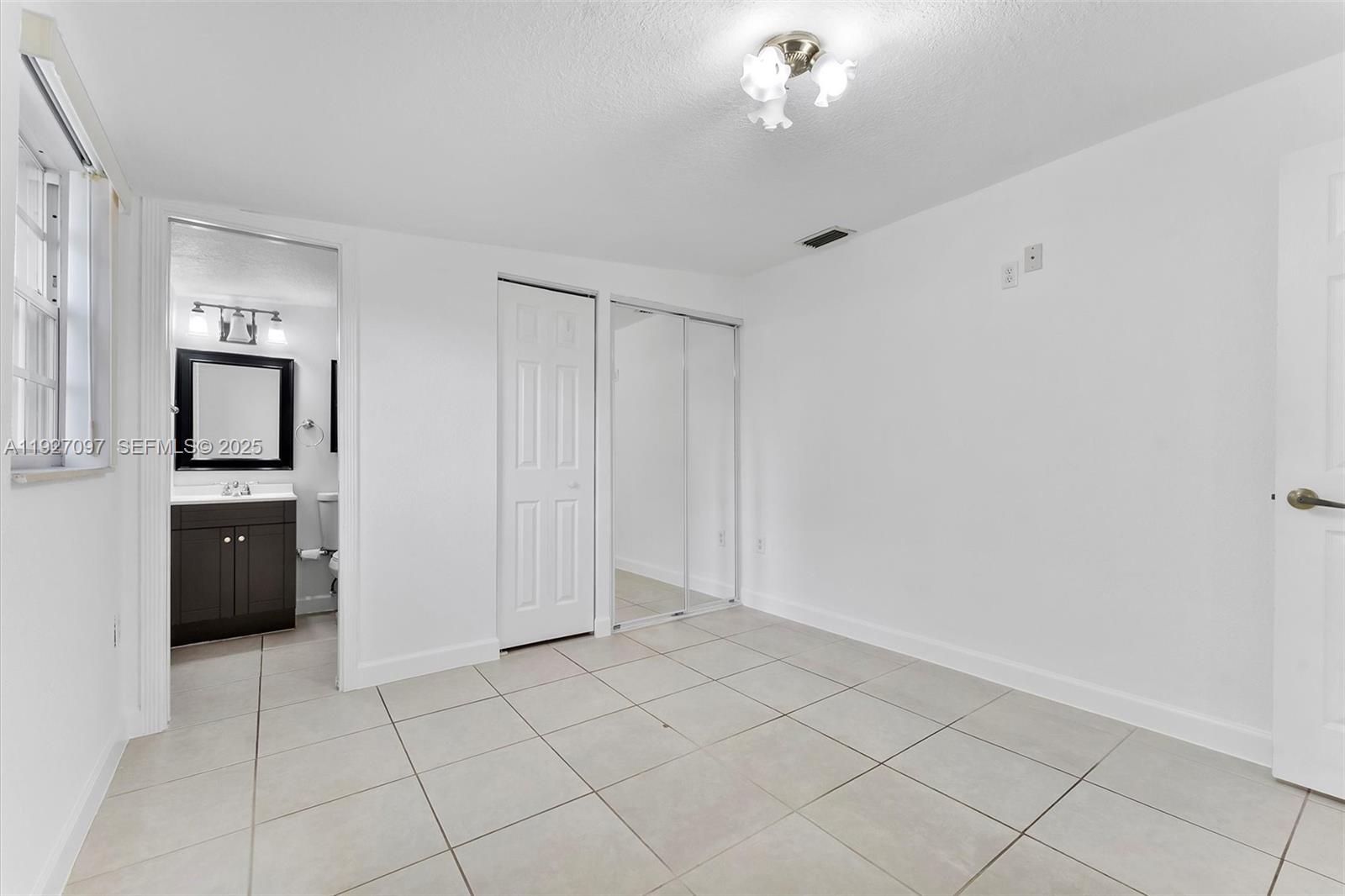 5511 Southwest 36th Court Davie, FL 33314 - Photo 13 of 23 a view of kitchen with windows cabinet and refrigerator