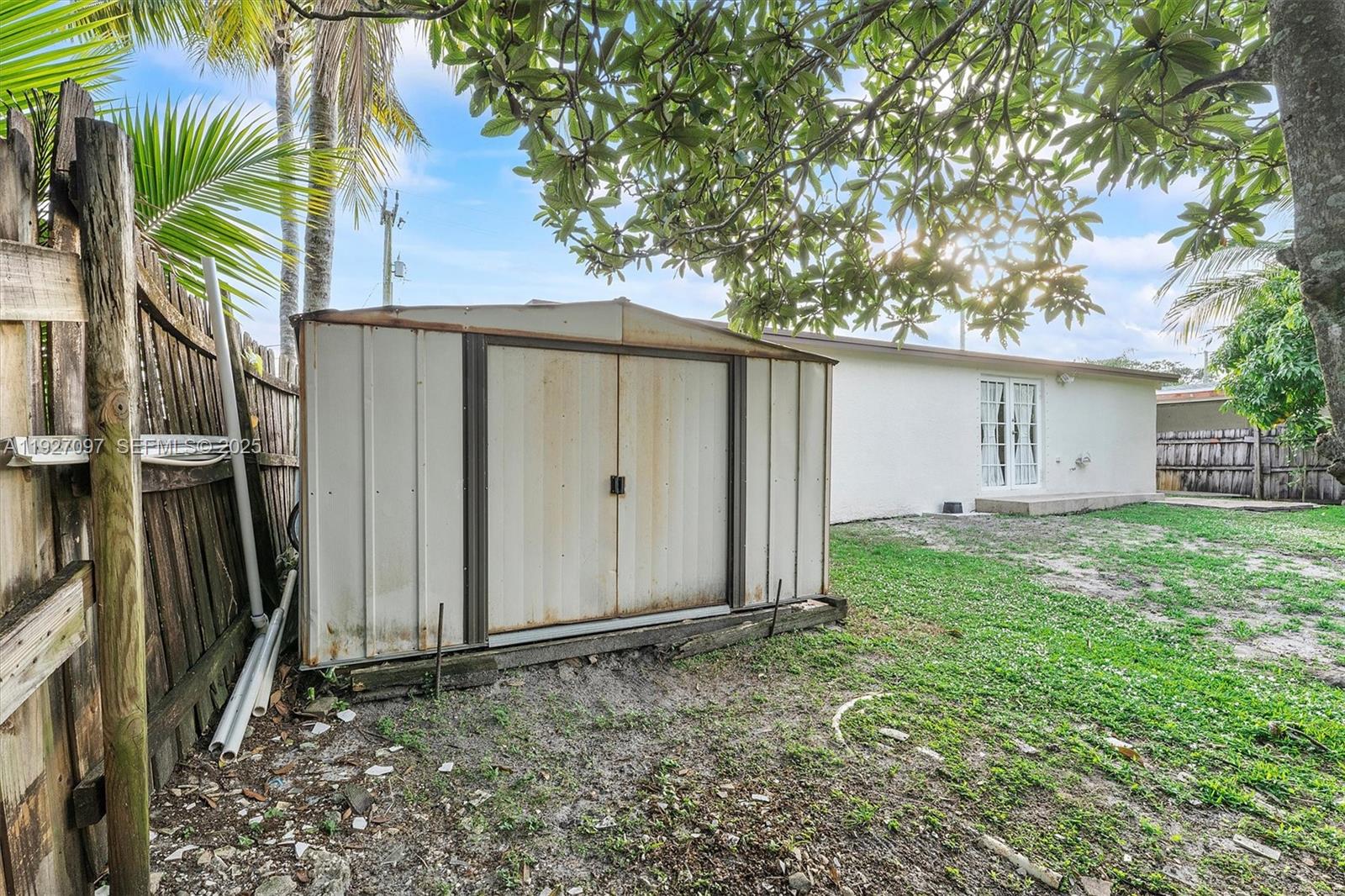 5511 Southwest 36th Court Davie, FL 33314 - Photo 20 of 23 a backyard of a house with lots of green space