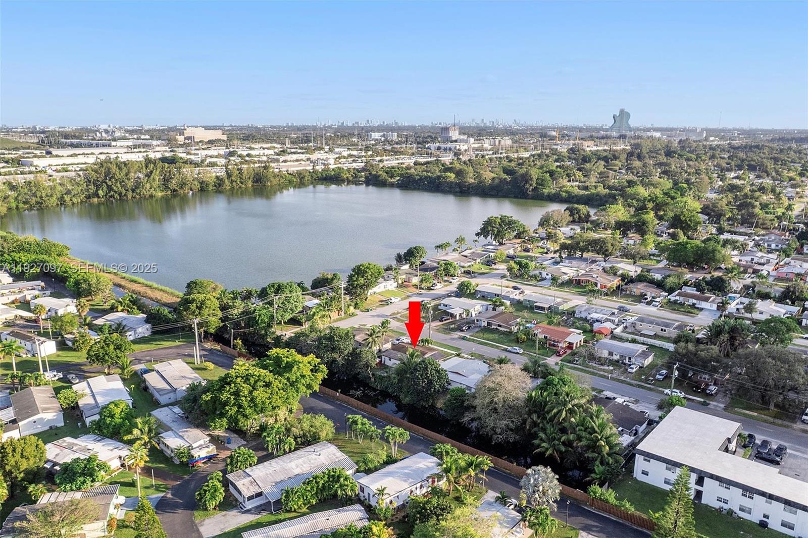 5511 Southwest 36th Court Davie, FL 33314 - Photo 2 of 23 an aerial view of a city with a lake view