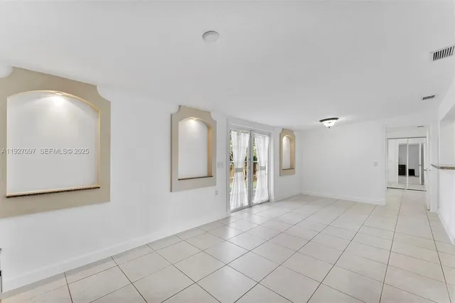 a view of an empty room and window