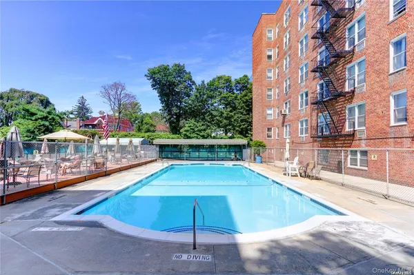 a view of a swimming pool with a chairs