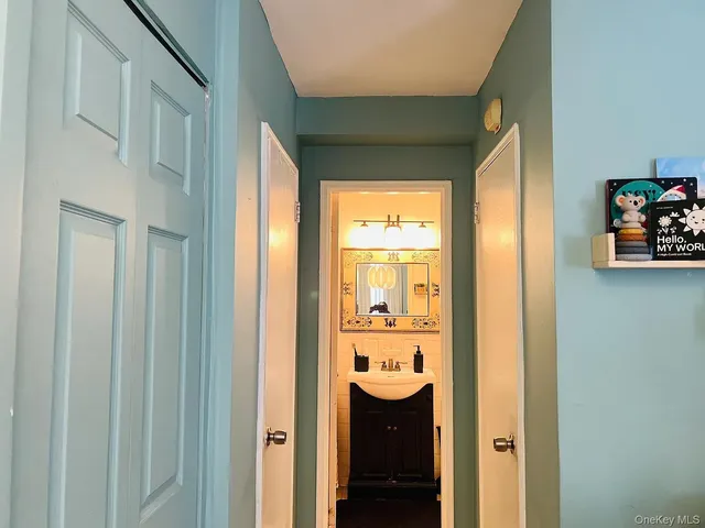 a view of a bathroom with a sink and a window