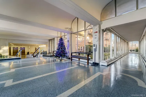a view of a hallway with seating area