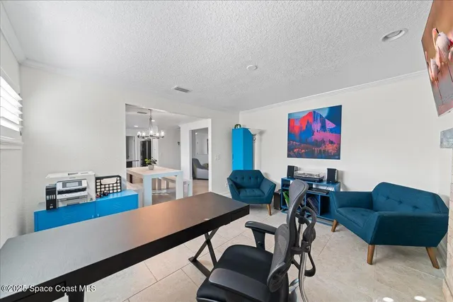 a kitchen with stainless steel appliances kitchen island granite countertop a refrigerator a stove a sink dishwasher and a dining table with wooden floor