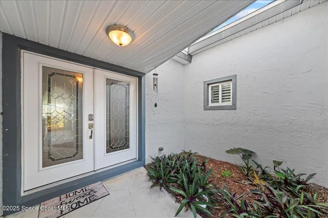 a bathroom with a bathtub and a window