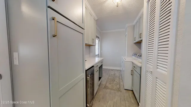 a living room with furniture a fireplace and next to a window