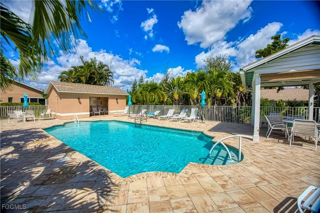 a view of a house with backyard porch and sitting area