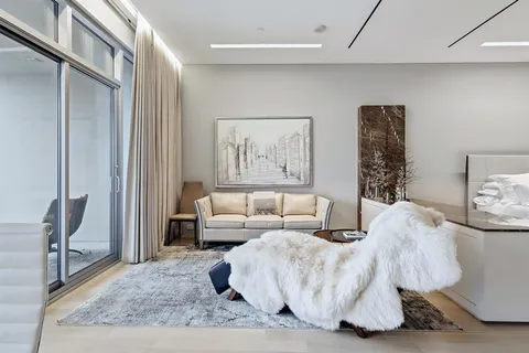 a living room with furniture and a rug