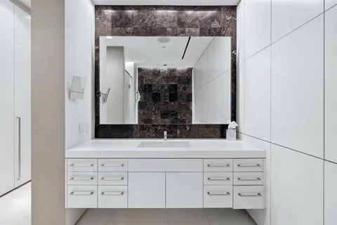 a bathroom with a bathtub and a mirror