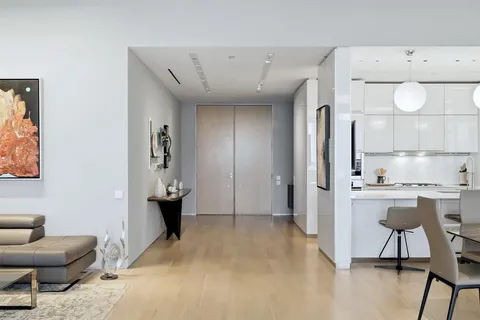 a view of kitchen with furniture and wooden floor