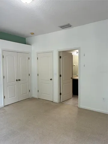 a bathroom with a sink double vanity and a mirror