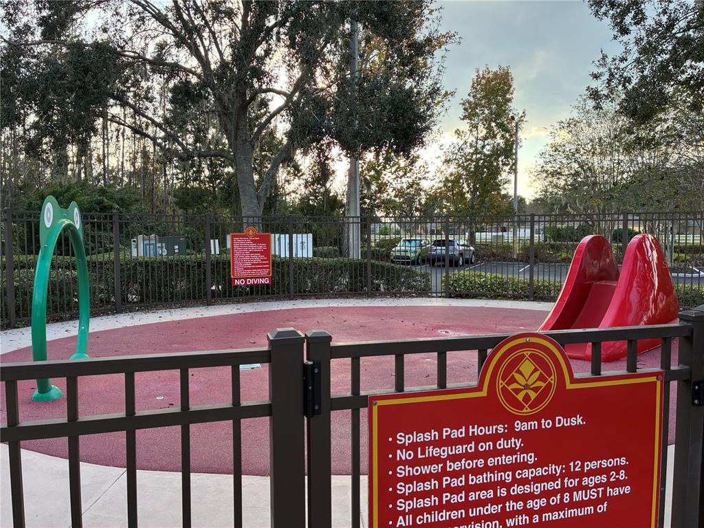 1110 Sleepy Oak Drive Wesley Chapel, FL 33543 - Photo 32 of 35 a view of outdoor space with seating area and sign board