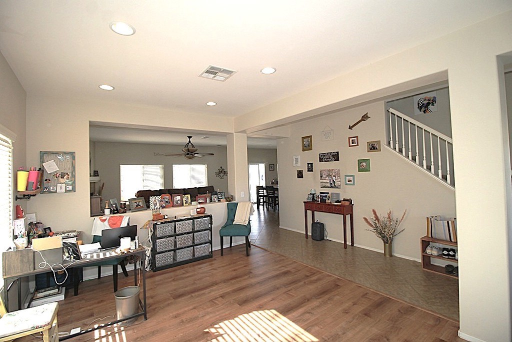 924 Condor Street Barstow, CA 92311 - Photo 9 of 52 a living room with furniture or wooden floor and a dining table
