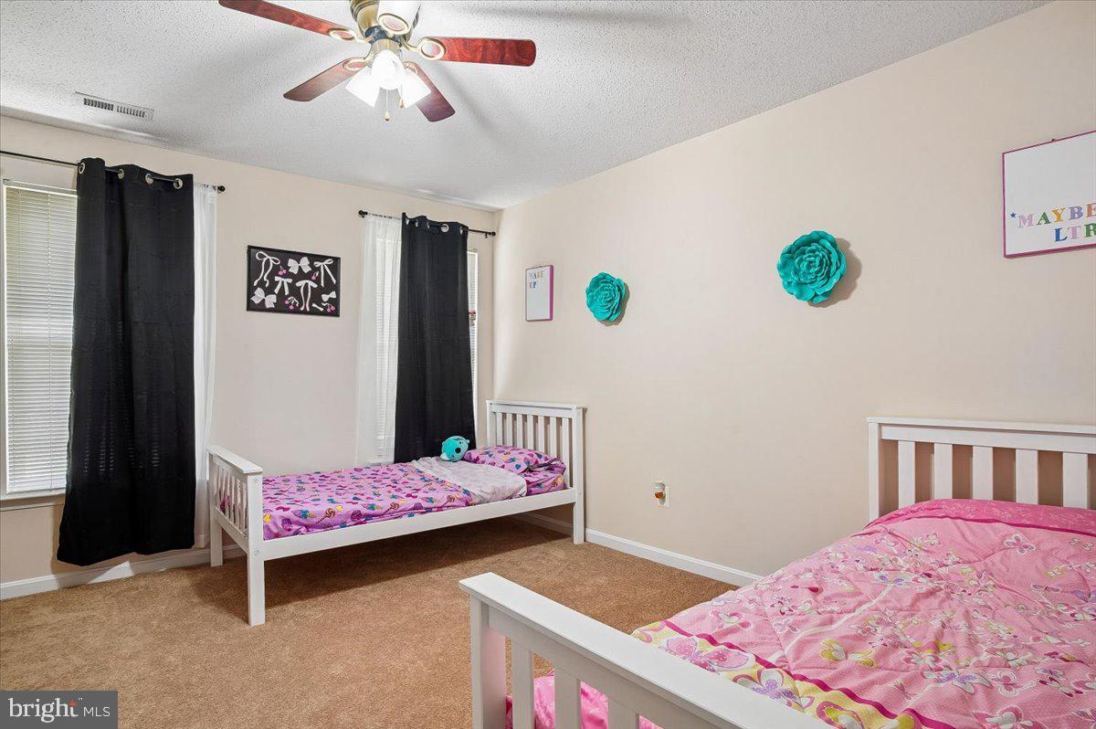 3470 Malcolm Road Brandywine, MD 20613 - Photo 17 of 36 a bedroom with a bed and a window