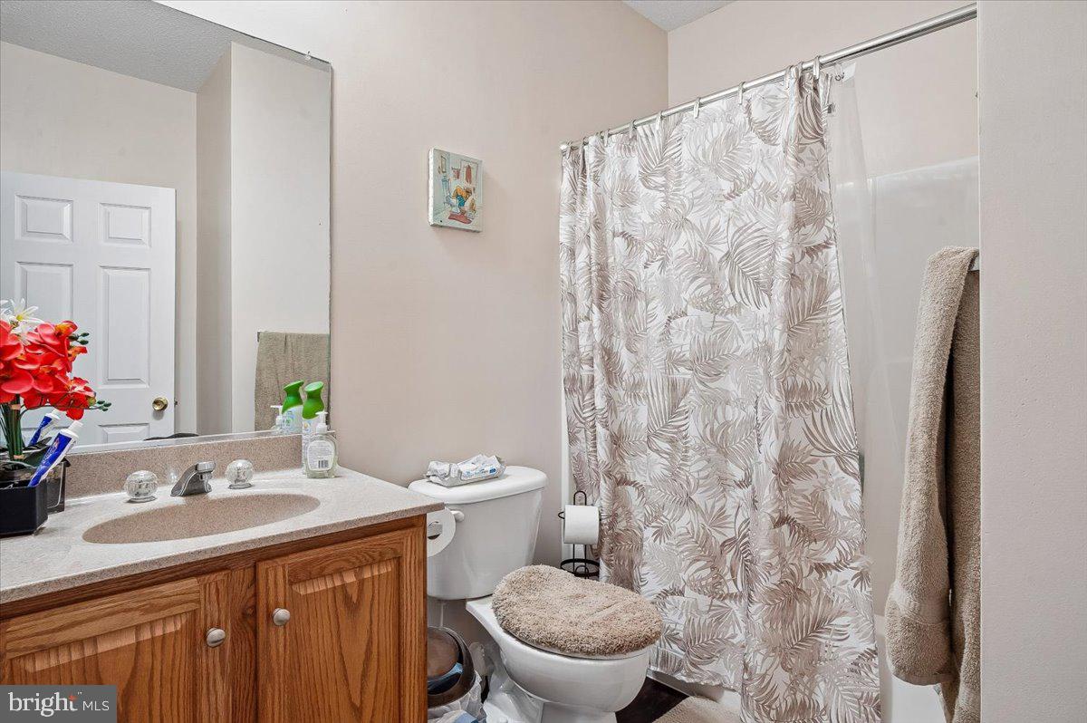3470 Malcolm Road Brandywine, MD 20613 - Photo 19 of 36 a bathroom with a sink toilet and shower