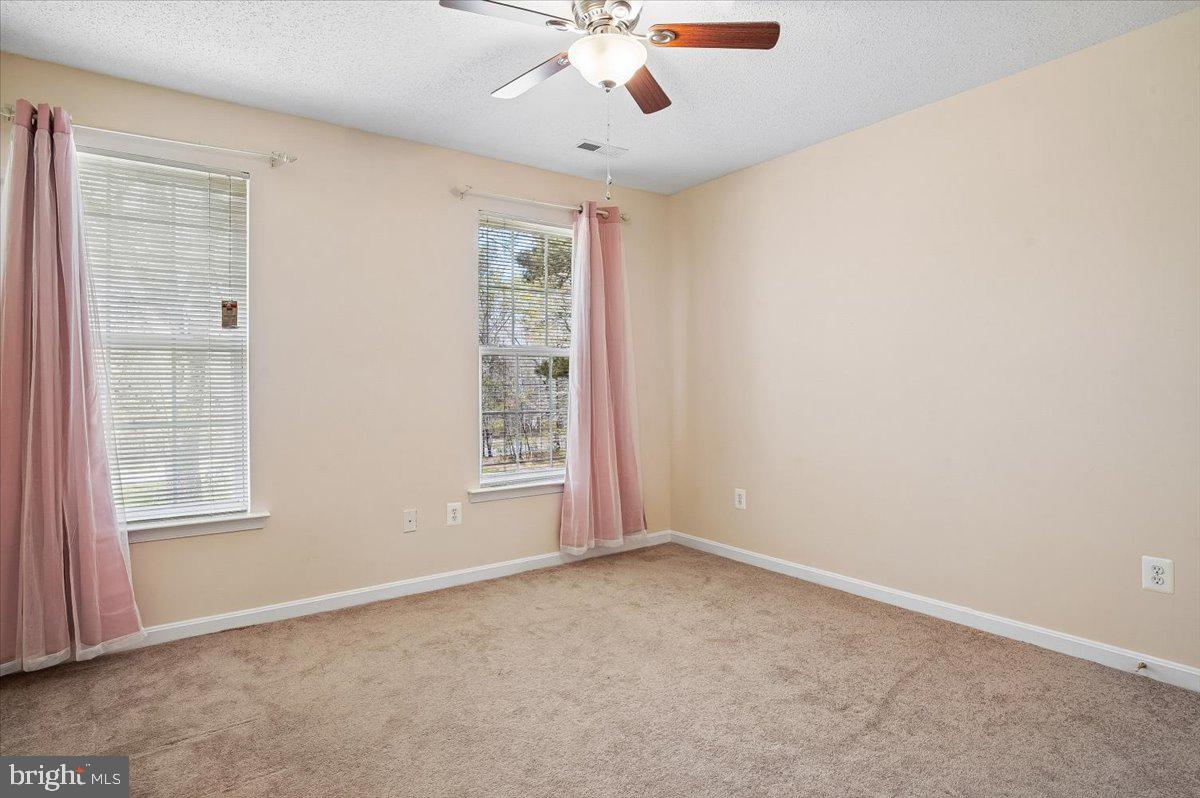 3470 Malcolm Road Brandywine, MD 20613 - Photo 20 of 36 an empty room with windows and fan