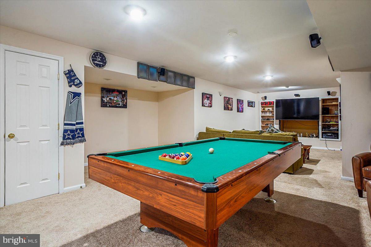 3470 Malcolm Road Brandywine, MD 20613 - Photo 24 of 36 a room with pool table and flat screen tv