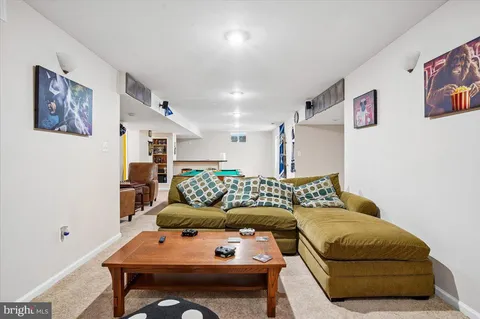 a living room with furniture and a couch