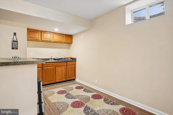 a bedroom with a stove and a cabinet