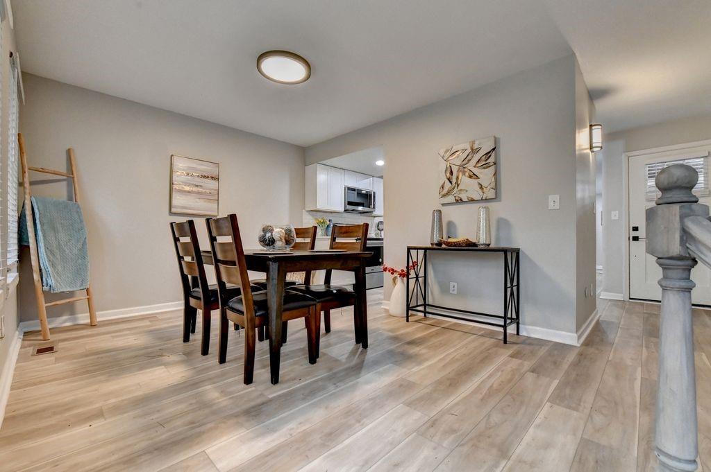 2503 Terrace Trail Decatur, GA 30035 - Photo 11 of 45 a view of a dining room with furniture and wooden floor