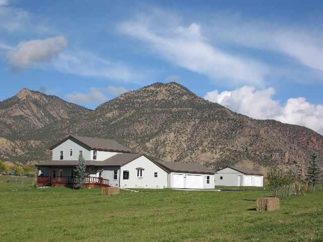 369 County Road 251 Rifle, CO 81650 - Photo 5 of 9 a view of a house with a big yard