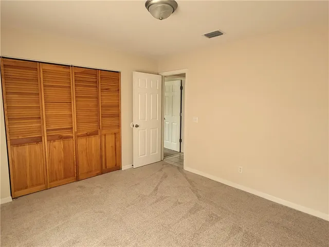 an empty room with wooden door