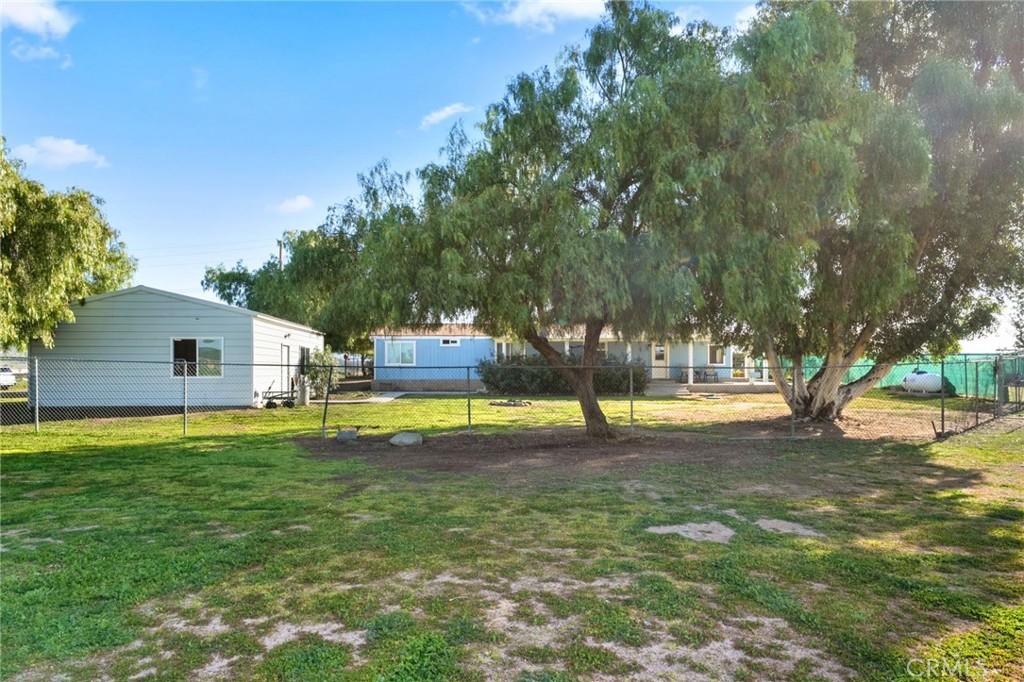 31615 Leon Road Winchester, CA 92596 - Photo 13 of 61 a view of a house with swimming pool and a yard