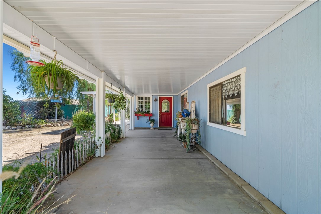 31615 Leon Road Winchester, CA 92596 - Photo 14 of 61 a view of a house with porch and garden