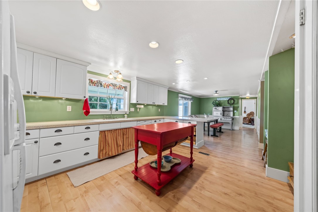 31615 Leon Road Winchester, CA 92596 - Photo 20 of 71 a living room with furniture a flat screen tv and a wooden floor