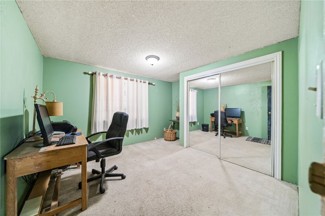 31615 Leon Road Winchester, CA 92596 - Photo 24 of 61 a view of a workspace with furniture and a gym