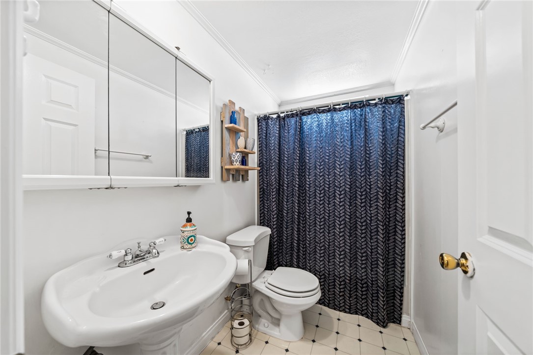 31615 Leon Road Winchester, CA 92596 - Photo 26 of 61 a bathroom with a sink a toilet and shower