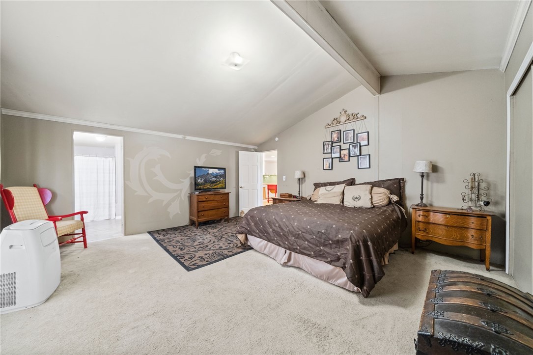31615 Leon Road Winchester, CA 92596 - Photo 29 of 61 a bedroom with a bed and a couch