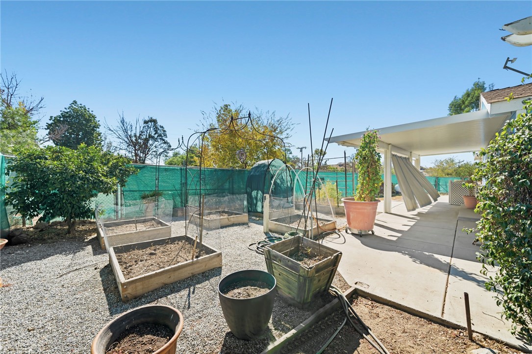 31615 Leon Road Winchester, CA 92596 - Photo 34 of 61 a view of a patio with table and chairs and potted plants