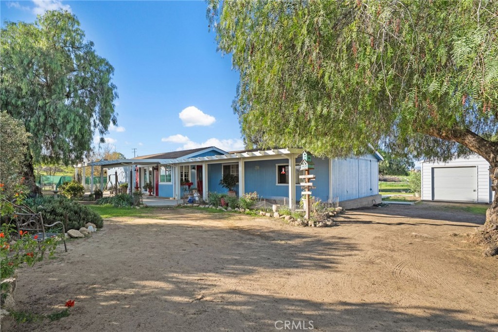 31615 Leon Road Winchester, CA 92596 - Photo 4 of 71 a front view of a house with a yard