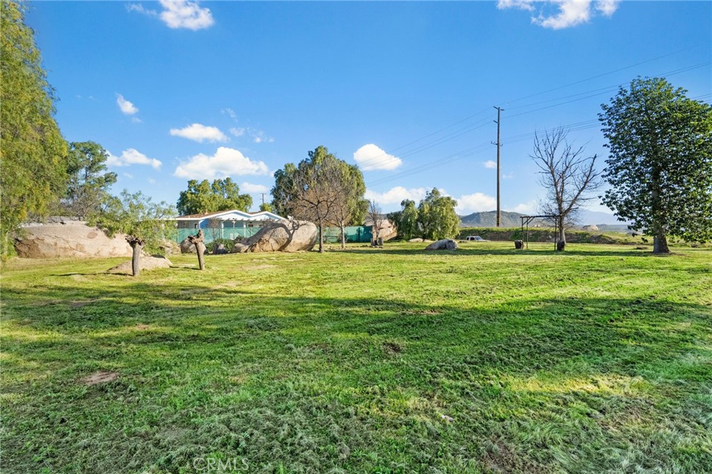31615 Leon Road Winchester, CA 92596 - Photo 42 of 71 a view of a golf course with a lake