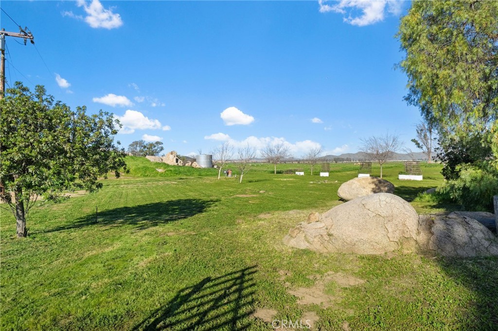 31615 Leon Road Winchester, CA 92596 - Photo 45 of 71 a view of a golf course with a lake