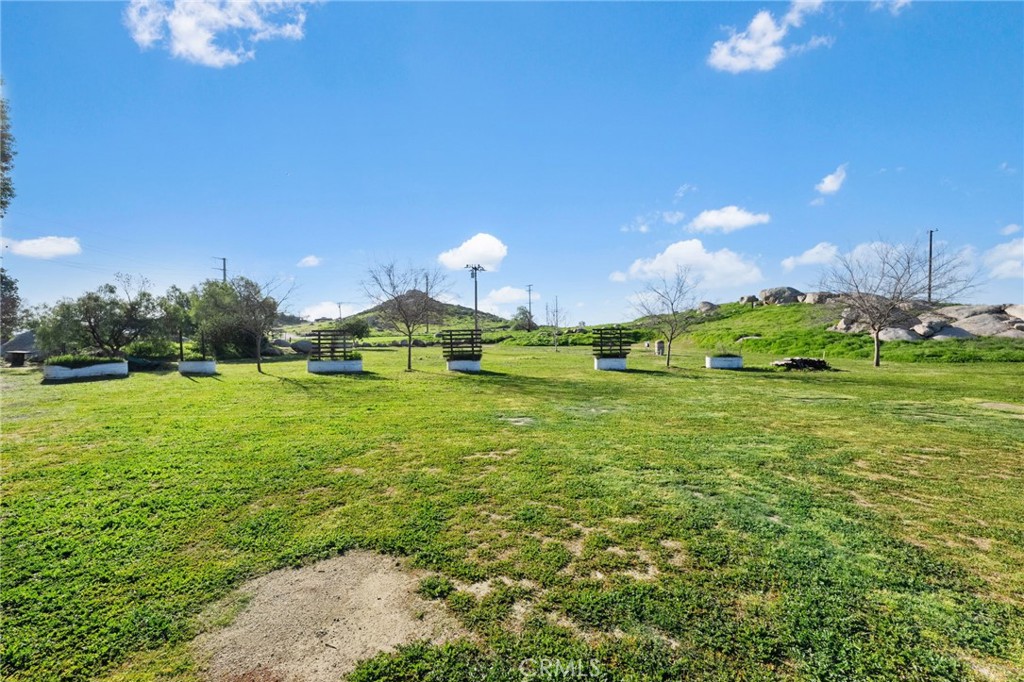 31615 Leon Road Winchester, CA 92596 - Photo 47 of 61 a view of a golf course with a lake view