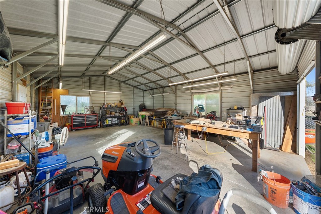 31615 Leon Road Winchester, CA 92596 - Photo 8 of 71 a living room with lots of furniture and clutter