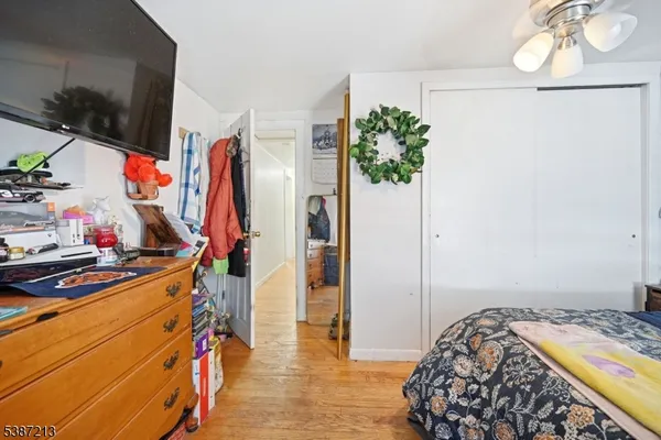 a bedroom with a bed and a closet