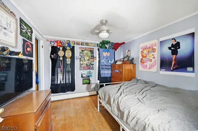 a bedroom with bed and window