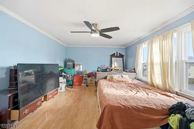 a bed room with a bed and a tv