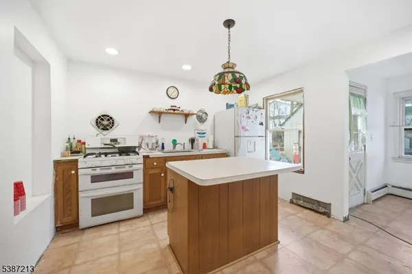 a kitchen with a stove and a sink