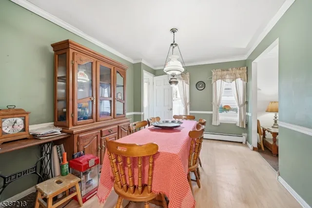 a view of a livingroom with furniture window and wooden floor